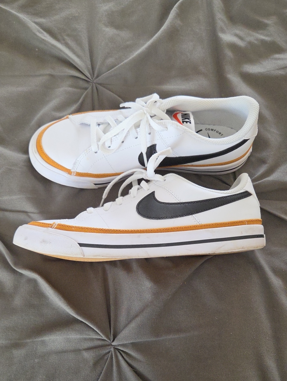 Nike Youth White Sneakers with Black Swoosh and Orange Accent